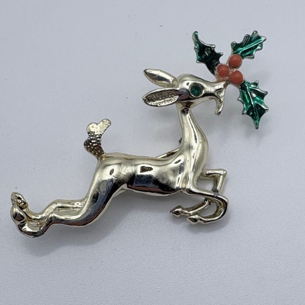 Goldstone Reindeer Pin with Green Holly, Red Berries and Green Rhinestone Eye